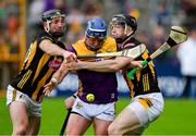 26 May 2024; Kevin Foley of Wexford is tackled by Conor Fogarty, left, and Walter Walsh of Kilkenny during the Leinster GAA Hurling Senior Championship Round 5 match between Kilkenny and Wexford at UPMC Nowlan Park in Kilkenny. Photo by Ray McManus/Sportsfile