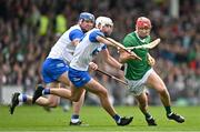 26 May 2024; Barry Nash of Limerick in action against Neil Montgomery, centre, and Darragh Lyons of Waterford during the Munster GAA Hurling Senior Championship Round 5 match between Limerick and Waterford at TUS Gaelic Grounds in Limerick Photo by Sam Barnes/Sportsfile
