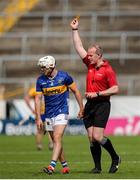 26 May 2024; Johnny Ryan of Tipperary is shown a yellow card by referee Johnny Murphy during the Munster GAA Hurling Senior Championship Round 5 match between Tipperary and Clare at FBD Semple Stadium in Thurles, Tipperary. Photo by Michael P Ryan/Sportsfile