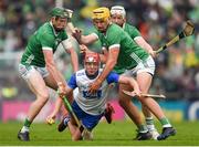 26 May 2024; Calum Lyons of Waterford is tackled by Will O Donoghue, left, and Cathal O Neill of Limerick during the Munster GAA Hurling Senior Championship Round 5 match between Limerick and Waterford at TUS Gaelic Grounds in Limerick Photo by Tom Beary/Sportsfile