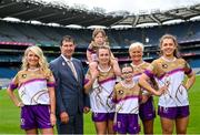 29 May 2024; Uachtarán Cumann Peil Gael na mBan, Mícheál Naughton with, from left, Avril Holmes, Niamh Carmody of Kerry with Roísín Whelan, age 3, Aryia Holmes, age 10, Joan O'Reilly and Clodagh McCambridge of Armagh at the LGFA launch of the 50th anniversary commemorative jersey at Croke Park in Dublin. Photo by David Fitzgerald/Sportsfile