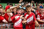 29 May 2024; Beaumont BNS, Blackrock, Cork, players Seán Connolly, left, and Tadhg Quirke celebrate after they won the A cup, for mixed small sized schools, during the FAI Primary 5s Finals day at Aviva Stadium in Dublin. Photo by Stephen McCarthy/Sportsfile