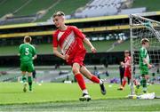 29 May 2024; Tom Ó Caoimh of Gaelscoil Choinn tSáile, Cork, celebrates after scoring a goal in their B Cup, for mixed medium sized schools, match against Scoil Phádraig, Westport, Mayo, during the FAI Primary 5s Finals day at Aviva Stadium in Dublin. Photo by Stephen McCarthy/Sportsfile