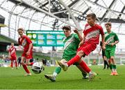 29 May 2024; Tadhg Quirke of Beaumont BNS, Blackrock, Cork, in action against Tadhg Murphy of St Joseph’s PS, Ballinrobe, Mayo, in their C Cup, for mixed large sized schools, match during the FAI Primary 5s Finals day at Aviva Stadium in Dublin. Photo by Stephen McCarthy/Sportsfile