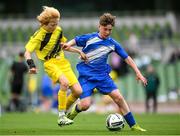 29 May 2024; Mossie Gillic of Kentstown NS, Meath, in action against Lewis Quinn of St Eunan’s NS, Raphoe, Donegal, in their section B cup, for mixed medium sized schools, match during the FAI Primary 5s Finals day at Aviva Stadium in Dublin. Photo by Stephen McCarthy/Sportsfile
