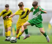 29 May 2024; Matthew Tierney of St Joseph’s PS, Ballinrobe, Mayo, in action against Ryan Gallagher of Illistrin NS, Donegal, in their section C cup, for mixed large sized schools, mathc during the FAI Primary 5s Finals day at Aviva Stadium in Dublin. Photo by Stephen McCarthy/Sportsfile