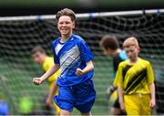 29 May 2024; Lennon O’Brien of Scoil Eoin, Crumlin, Dublin, celebrates after scoring against Scoil Íosagáin, Buncrana, Inishowen, Donegal, in their Football For All cup match during the FAI Primary 5s Finals day at Aviva Stadium in Dublin. Photo by Stephen McCarthy/Sportsfile