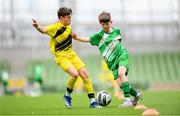 29 May 2024; Matthew Tierney of St Joseph’s PS, Ballinrobe, Mayo, and Oisin Cuskelly of Illistrin NS, Donegal, left, during the FAI Primary 5s Finals day at Aviva Stadium in Dublin. Photo by Stephen McCarthy/Sportsfile