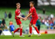 29 May 2024; Kieran Stack, left, and Tadhg Quirke of Beaumont BNS, Blackrock, Cork, celebrate a goal during the FAI Primary 5s Finals day at Aviva Stadium in Dublin. Photo by Stephen McCarthy/Sportsfile
