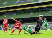 29 May 2024; Action from the section B cup, for mixed medium sized schools, match between Gaelscoil Choinn tSáile, Cork, and Scoil Phádraig, Westport, Mayo, during the FAI Primary 5s Finals day at Aviva Stadium in Dublin. Photo by Stephen McCarthy/Sportsfile