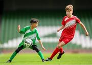 29 May 2024; Mounir Soufan of Scoil Phádraig, Westport, Mayo, in action against Noah Ó Laoi of Gaelscoil Choinn tSáile, Cork, right, during the FAI Primary 5s Finals day at Aviva Stadium in Dublin. Photo by Stephen McCarthy/Sportsfile
