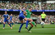 31 May 2024; Kyra Carusa of Republic of Ireland is tackled by Nathalie Björn of Sweden during the 2025 UEFA Women's European Championship qualifying match between Republic of Ireland and Sweden at Aviva Stadium in Dublin. Photo by Stephen McCarthy/Sportsfile