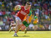 1 June 2024; Kevin Flahive of Cork in action against Oisin Gallen of Donegal during the GAA Football All-Ireland Senior Championship Round 2 match between Cork and Donegal at Páirc Uí Rinn in Cork. Photo by Matt Browne/Sportsfile