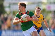 1 June 2024; Aidan O'Shea of Mayo in action against Conor Hand of Roscommon during the GAA Football All-Ireland Senior Championship Round 2 match between Roscommon and Mayo at Dr Hyde Park in Roscommon. Photo by Ben McShane/Sportsfile