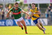 1 June 2024; Conor Hand of Roscommon in action against Aidan O'Shea of Mayo during the GAA Football All-Ireland Senior Championship Round 2 match between Roscommon and Mayo at Dr Hyde Park in Roscommon. Photo by Ben McShane/Sportsfile