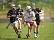 1 June 2024; Ciaran McKena of Tyrone in action against Oisin O'Raghlailaigh and Dylan Walsh of Sligo during the Electric Ireland Corn Jerome O'Leary Celtic Challenge final match between Tyrone and Sligo at Fr Tierney Park in Ballyshannon, Donegal. Photo by Oliver McVeigh/Sportsfile