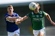 1 June 2024; Evan O'Carroll of Laois is tackled by Ultán Kelm of Fermanagh during the Tailteann Cup Group 3 Round 3 match between Fermanagh and Laois at Glennon Brothers Pearse Park in Longford. Photo by Tom Beary/Sportsfile