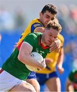 1 June 2024; Matthew Ruane of Mayo is tackled by Ciarán Lennon of Roscommon during the GAA Football All-Ireland Senior Championship Round 2 match between Roscommon and Mayo at Dr Hyde Park in Roscommon. Photo by Ben McShane/Sportsfile