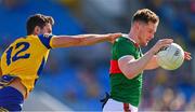 1 June 2024; Matthew Ruane of Mayo is tackled by Ciarán Lennon of Roscommon during the GAA Football All-Ireland Senior Championship Round 2 match between Roscommon and Mayo at Dr Hyde Park in Roscommon. Photo by Ben McShane/Sportsfile