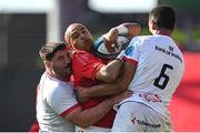 1 June 2024; Simon Zebo of Munster is tackled by Ulster players Tom O’Toole, left, and Cormac Izuchukwu during the United Rugby Championship match between Munster and Ulster at Thomond Park in Limerick. Photo by Seb Daly/Sportsfile