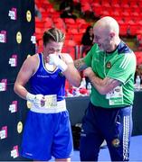 2 June 2024; Grainne Walsh of Ireland is congratulated by her coach Damian Kennedy while holding a ticket after winning in Women's 66kg Quarterfinals against Ani Hovsepyan of Armenia at the Paris 2024 Olympic Boxing Qualification Tournament at Hua Mak Indoor Stadium in Bangkok, Thailand. Photo by Joe Walsh/Sportsfile