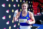 2 June 2024; Grainne Walsh of Ireland celebrates while holding a ticket and a mascot after winning in Women's 66kg Quarterfinals against Ani Hovsepyan of Armenia at the Paris 2024 Olympic Boxing Qualification Tournament at Hua Mak Indoor Stadium in Bangkok, Thailand. Photo by Joe Walsh/Sportsfile