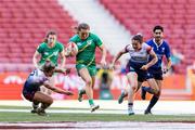 2 June 2024; Béibhinn Parsons of Ireland in action against Amy Wilson Hardy, left, and Kayleigh Powell of Great Britain during the HSBC Women's SVNS 2024 Grand Finals play-off match between Ireland and Great Britain at Civitas Metropolitano Stadium in Madrid, Spain. Photo by Juan Gasparini/Sportsfile
