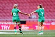 2 June 2024; Ireland players Erin King, left,  shakes hand with Béibhinn Parsons during the HSBC Women's SVNS 2024 Grand Finals play-off match between Ireland and Great Britain at Civitas Metropolitano Stadium in Madrid, Spain. Photo by Juan Gasparini/Sportsfile