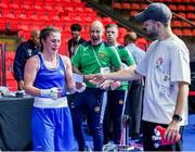 2 June 2024; Grainne Walsh of Ireland receiving her 'ticket to Paris' after defeating Ani Hovsepyan of Armenia during their Women's 66kg Quarterfinals at the Paris 2024 Olympic Boxing Qualification Tournament at Hua Mak Indoor Stadium in Bangkok, Thailand. Photo by Joe Walsh/Sportsfile
