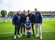31 May 2024; Matchday mascot Charlie Reynolds with Leinster players Jordan Larmour, James Lowe, Ross Byrne and Will Connors during the United Rugby Championship match between Leinster and Connacht at the RDS Arena in Dublin. Photo by Harry Murphy/Sportsfile