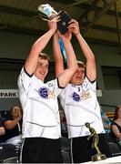 2 June 2024; Joint-captains Liam Fitzgerald, left, and Matthew McSweeney of East Cork lift the John Scott Celtic Challenge cup after the Electric Ireland Corn John Scott Celtic Challenge final match between East Cork and Dublin at UPMC Nowlan Park in Kilkenny. Photo by Tom Beary/Sportsfile