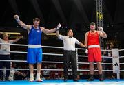 2 June 2024; Davit Chaloyan of Armenia, left, is declared victorious against Martin McDonagh of Ireland, after their Men's +92kg Finals at the Paris 2024 Olympic Boxing Qualification Tournament at Hua Mak Indoor Stadium in Bangkok, Thailand. Photo by Joe Walsh/Sportsfile