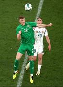 4 June 2024; Jake O'Brien of Republic of Ireland in action against Roland Sallai of Hungary during the international friendly match between Republic of Ireland and Hungary at Aviva Stadium in Dublin. Photo by Michael P Ryan/Sportsfile