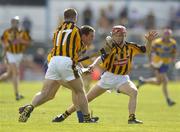 31 July 2004; Barry Murphy, Clare, in action against Michael Kavanagh (17) and Tommy Walsh, Kilkenny. Guinness All-Ireland Hurling Championship Quarter Final Replay, Clare v Kilkenny, Semple Stadium, Thurles, Co. Tipperary. Picture credit; Brendan Moran / SPORTSFILE