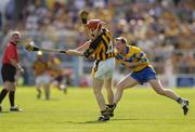 31 July 2004; Tommy Walsh, Kilkenny, in action against James O'Connor, Clare. Guinness All-Ireland Hurling Championship Quarter Final Replay, Clare v Kilkenny, Semple Stadium, Thurles, Co. Tipperary. Picture credit; Brendan Moran / SPORTSFILE