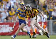 31 July 2004; Peter Barry, Kilkenny, in action against Tony Griffin, Clare. Guinness All-Ireland Hurling Championship Quarter Final Replay, Clare v Kilkenny, Semple Stadium, Thurles, Co. Tipperary. Picture credit; Brendan Moran / SPORTSFILE