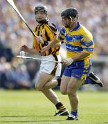 31 July 2004; David Forde, Clare, in action against JJ Delaney, Kilkenny. Guinness All-Ireland Hurling Championship Quarter Final Replay, Clare v Kilkenny, Semple Stadium, Thurles, Co. Tipperary. Picture credit; Brendan Moran / SPORTSFILE