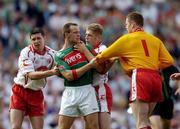 7 August 2004; David Brady, Mayo, in an altercation with Sean Cavanagh, left, Kevin Hughes and goalkeeper Pascal McConnell, Tyrone. Bank of Ireland All-Ireland Senior Football Championship Quarter Final, Mayo v Tyrone, Croke Park, Dublin. Picture credit; Brendan Moran / SPORTSFILE