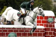7 August 2004; Ireland's Cian O'Connor on Ortwin De Laubry jumps the wall during the Land Rover Puissance. Dublin Horse Show, Main Arena, RDS, Dublin. Picture credit; Matt Browne / SPORTSFILE