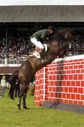 7 August 2004; Ireland's Edward Doyle on Midnight Call jumps the wall during the Land Rover Puissance. Dublin Horse Show, Main Arena, RDS, Dublin. Picture credit; Matt Browne / SPORTSFILE