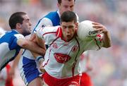 1 August 2004; Sean Cavanagh, Tyrone, in action against Aidan Fennelly, left, and Kevin Fitzpatrick, Laois. Bank of Ireland All-Ireland Football Championship, Round 4, Laois v Tyrone, Croke Park, Dublin. Picture credit; Brian Lawless / SPORTSFILE