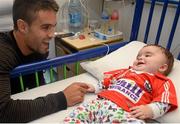 18 September 2013; Munster and Ireland Rugby star Conor Murray made a special visit to Temple Street Children’s University Hospital, as part of Temple Street’s 'Kiss Them Better' campaign. On the visit to the hospital Conor urged Irish families to buy Medicare plasters to support Temple Street. For every pack of Medicare plasters bought from pharmacies throughout the country, the Limerick based first-aid company will make a donation to the hospital's emergency equipment fund. Check out www.kissthembetter.ie for more information. Pictured with Conor Murray during the visit is 6-month-old Daniel Dempsey, from Clonakilty, Co. Cork. Temple Street Children's University Hospital, Temple Street, Dublin. Picture credit: Stephen McCarthy / SPORTSFILE