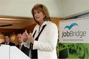 18 September 2013; Minister for Social Protection Joan Burton T.D, and the FAI teamed up to highlight the success of JobBridge. The number of internships taken up under JobBridge, the National Internship Scheme, has now passed 20,000. Five former JobBridge participants who completed internships at the FAI now work in a full-time capacity with the Association while eight people are currently on JobBridge placements there. Speaking at the announcement is Minister for Social Protection Joan Burton T.D. FAI Headquarters, Abbotstown, Dublin. Picture credit: Brian Lawless / SPORTSFILE