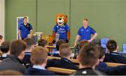19 September 2013; Pictured at the official launch of Leinster Rugby’s Bank of Ireland Treble Trophy Tour at Newbridge Post Primary School, Co. Kildare is Leinster academy player and local Newbridge lad, James Tracy as he answers questions from the children of the school. Schools interested in turning their school Leinster Blue and receiving a visit from the treble trophies, the Amlin Challenge Cup, RaboDirect PRO12, British and Irish Cup should email - trophy@leinsterrugby.ie. Supported by Bank of Ireland, Newbridge Post Primary School, was the first school to receive the three trophies on their provincial tour which continues throughout the school year. Leinster fans can keep up to date by following @leinstertrophytour on Twitter or at www.Facebook.com/leinsterrugbytrophytour! Newbridge Post Primary School, Newbridge, Co. Kildare. Picture credit: Barry Cregg / SPORTSFILE