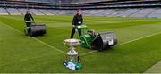 20 September 2013; The Sam Maguire cup sits proud as Croke Park pitch manager Stuart Wilson, right, and groundsman Padhraic Greene cut the pitch ahead of the GAA Football All-Ireland Senior Championship Final between Dublin and Mayo on Sunday. Croke Park, Dublin. Picture credit: Ray McManus / SPORTSFILE
