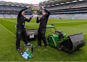 20 September 2013; Croke Park pitch manager Stuart Wilson, left, and groundsman Padhraic Greene jostle for possession of the Sam Maguire cup after cutting the pitch ahead of the GAA Football All-Ireland Senior Championship Final between Dublin and Mayo on Sunday. Croke Park, Dublin. Picture credit: Ray McManus / SPORTSFILE