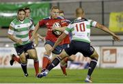 20 September 2013; Munster's Keith Earls attempts to break through the Benetton Treviso defence. Celtic League 2013/14, Round 3, Benetton Treviso v Munster, Stadio Monigo, Treviso, Italy. Picture credit: Roberto Bregani / SPORTSFILE