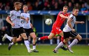 7 June 2024; Liam Burt of Shelbourne in action against Dundalk players Paul Doyle, left, and John Mountney during the SSE Airtricity Men's Premier Division match between Shelbourne and Dundalk at Tolka Park in Dublin. Photo by Seb Daly/Sportsfile