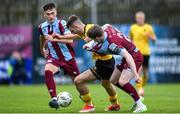 7 June 2024; Mason Melia of St Patrick's Athletic is tackled by Conor Kane, right, and Evan Weir of Drogheda United during the SSE Airtricity Men's Premier Division match between Drogheda United and St Patrick's Athletic at Weavers Park in Drogheda, Louth. Photo by Shauna Clinton/Sportsfile