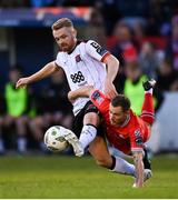 7 June 2024; Paul Doyle of Dundalk in action against Liam Burt of Shelbourne during the SSE Airtricity Men's Premier Division match between Shelbourne and Dundalk at Tolka Park in Dublin. Photo by Seb Daly/Sportsfile